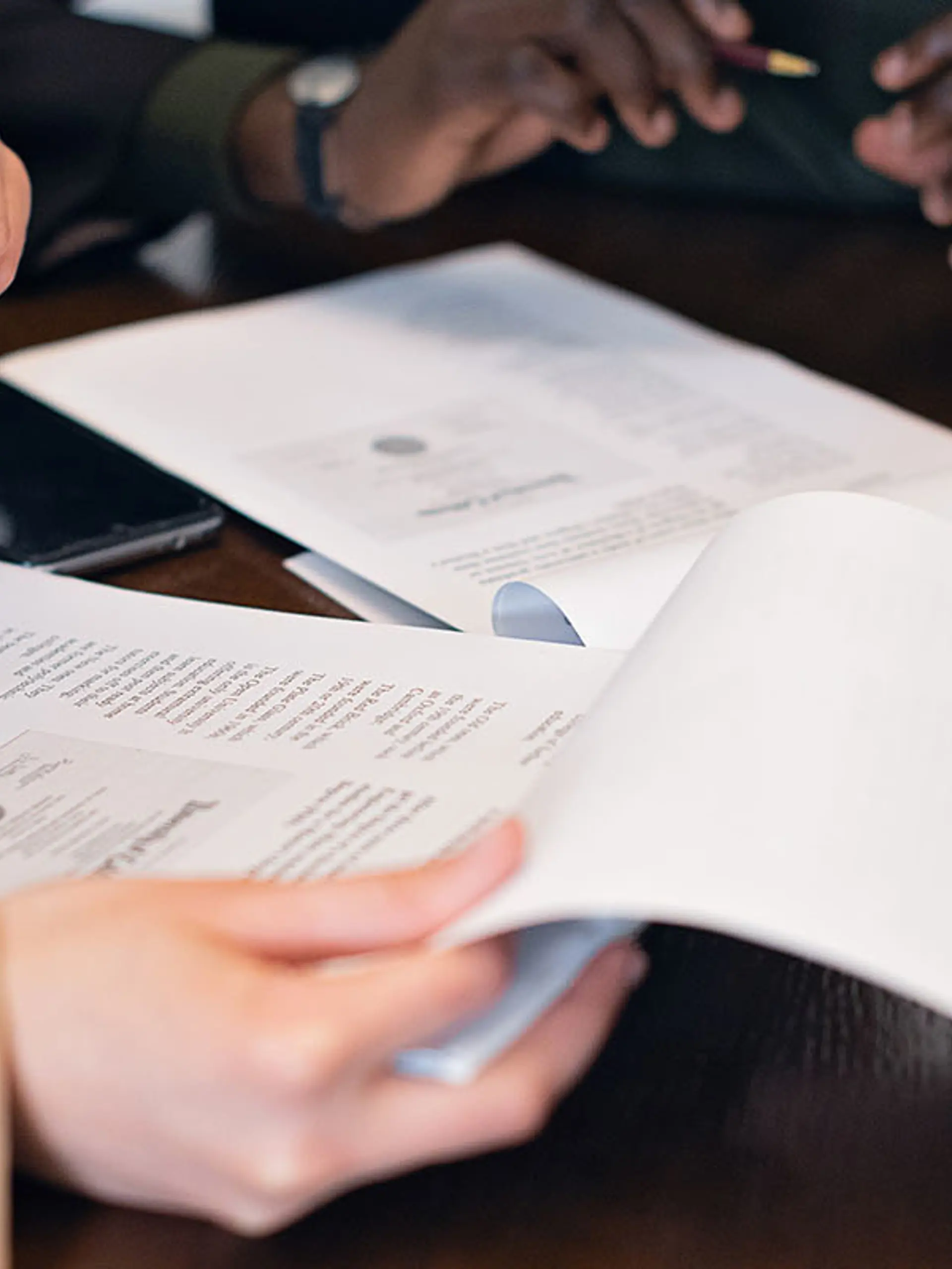 Industry Standards Woman And Man Reading Documents